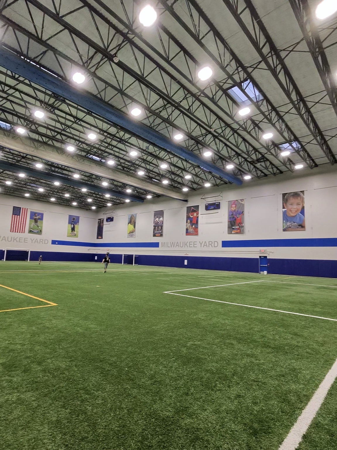 Inside The Milwaukee Yard: indoor turf field with high ceilings and bright lights